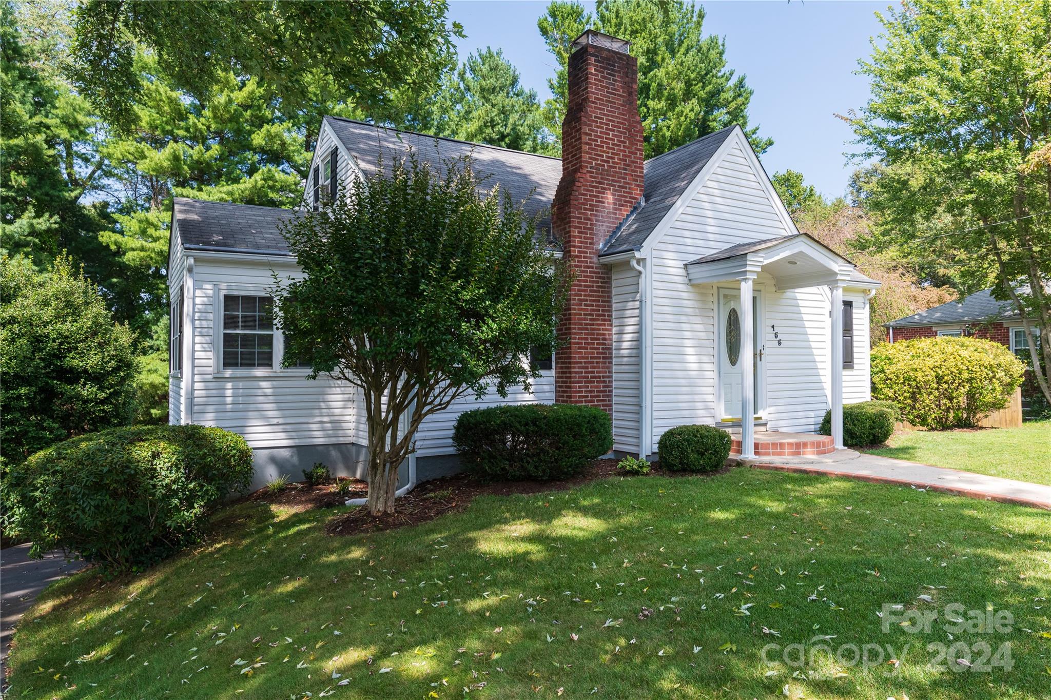 155 Arthur Road Asheville, NC 28806 - Photo 1 of 29 a view of a house with a yard and plants
