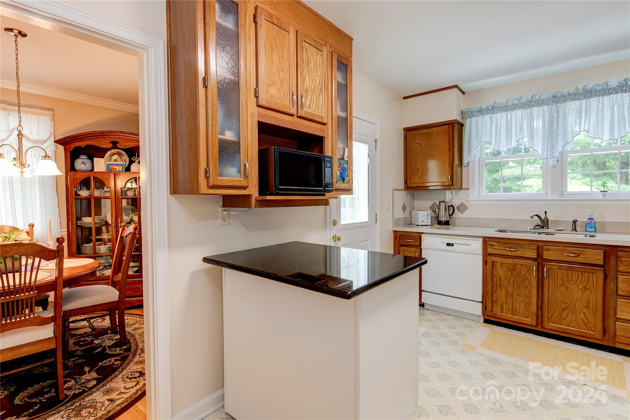 155 Arthur Road Asheville, NC 28806 - Photo 12 of 29 a kitchen with stainless steel appliances granite countertop a stove a sink and a microwave