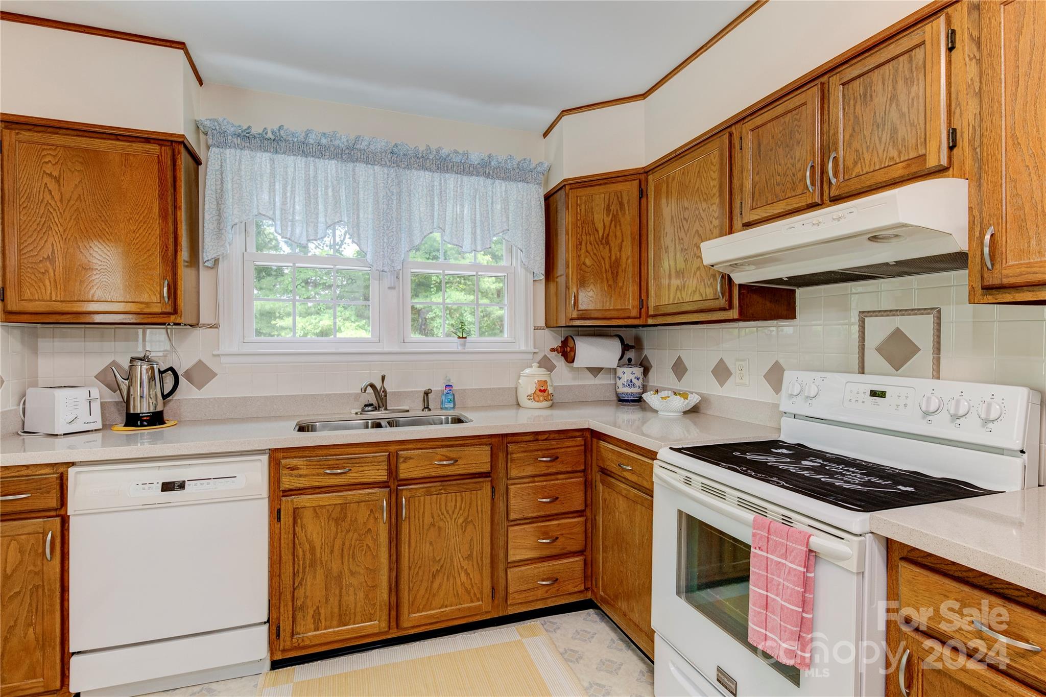 155 Arthur Road Asheville, NC 28806 - Photo 13 of 29 a kitchen with stainless steel appliances a sink stove and cabinets