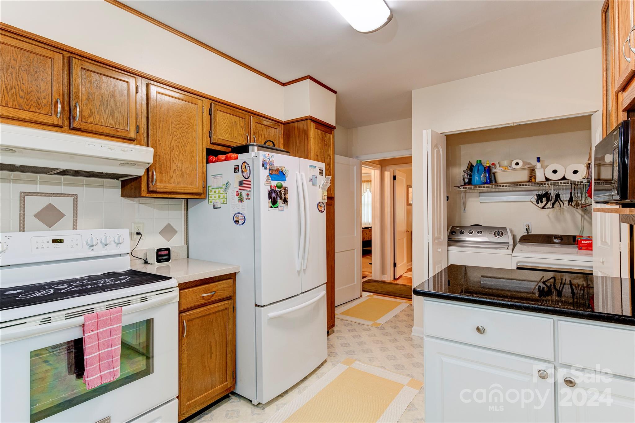155 Arthur Road Asheville, NC 28806 - Photo 14 of 29 a kitchen with stainless steel appliances granite countertop a refrigerator and a stove