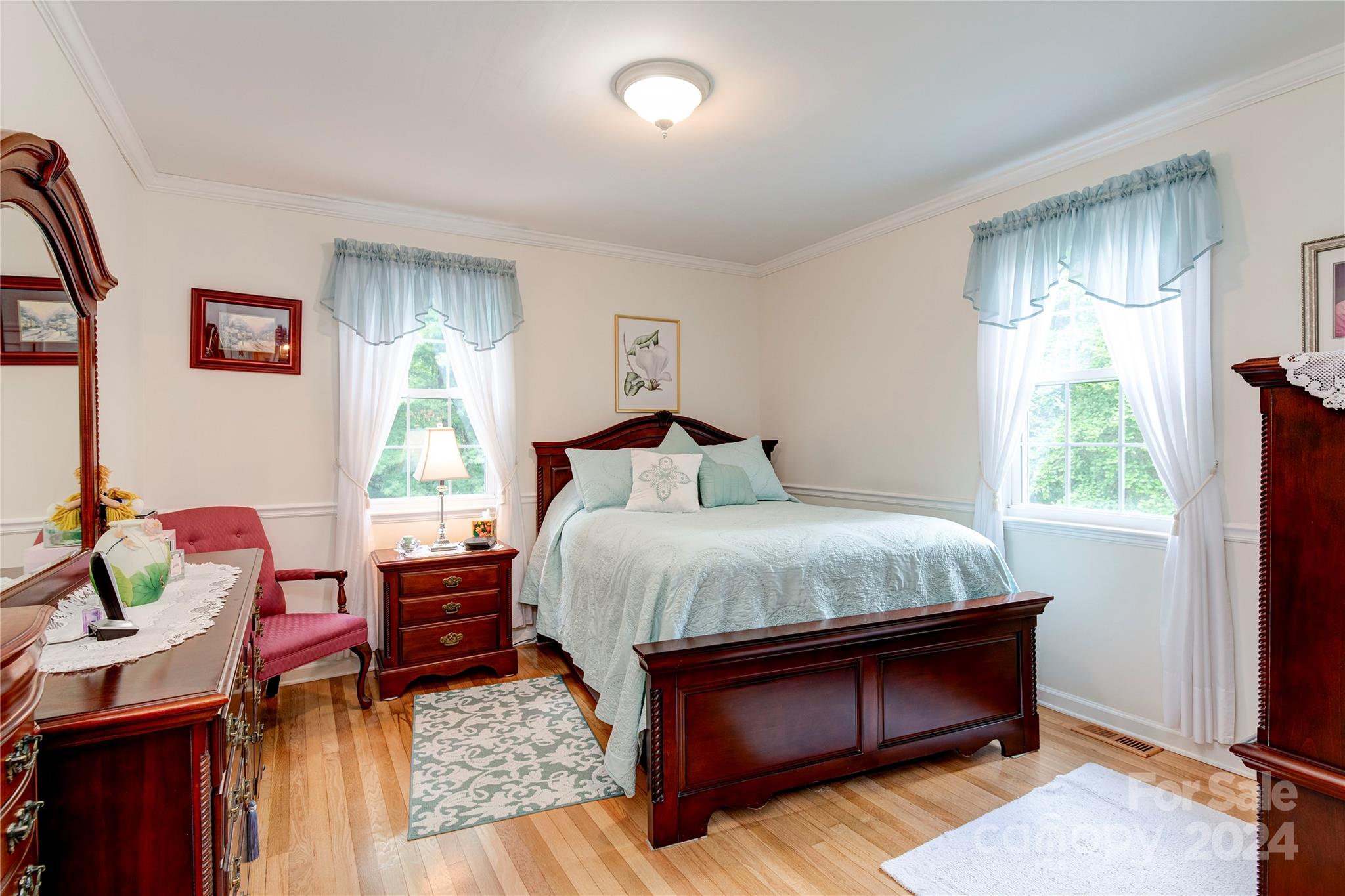 155 Arthur Road Asheville, NC 28806 - Photo 15 of 29 a bedroom with a bed and a dresser next to a window