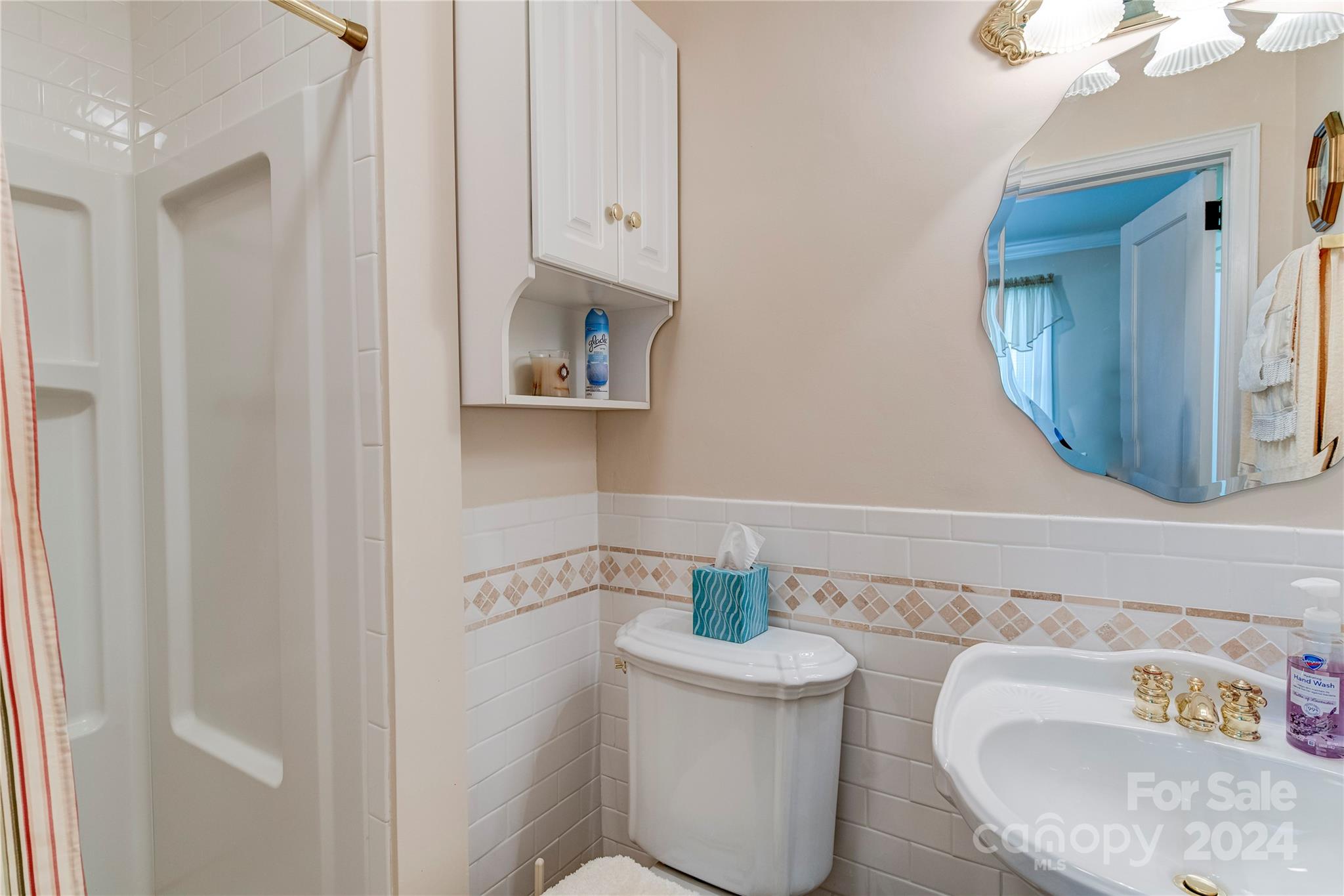 155 Arthur Road Asheville, NC 28806 - Photo 20 of 29 a bathroom with a sink and a mirror