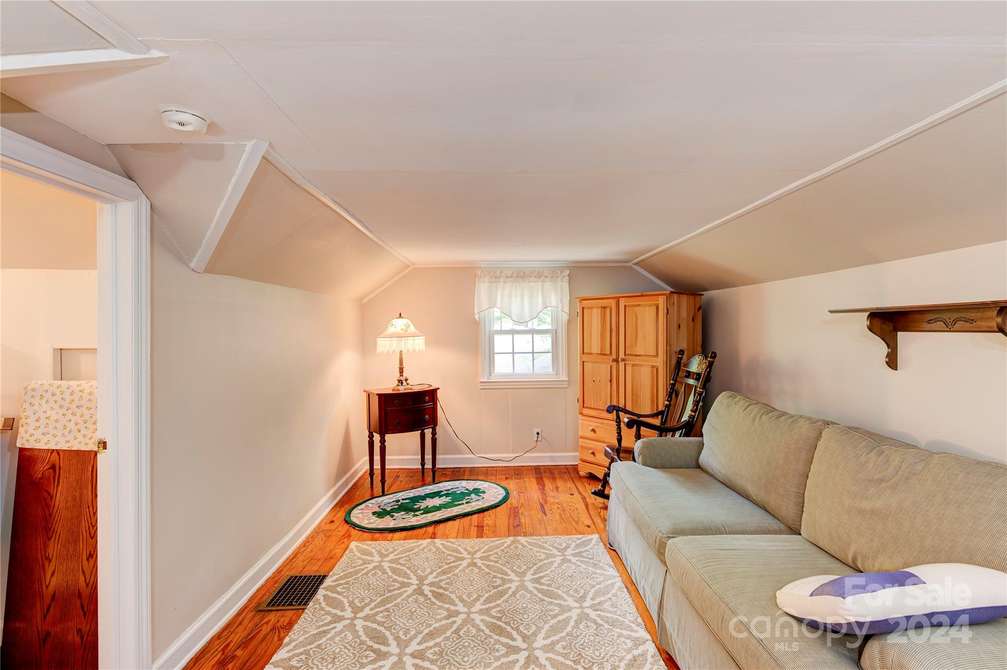 155 Arthur Road Asheville, NC 28806 - Photo 21 of 29 a living room with furniture and a lamp