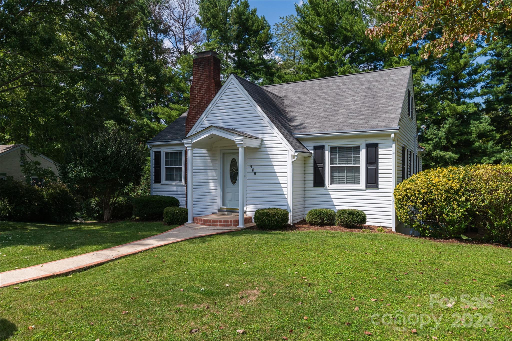 155 Arthur Road Asheville, NC 28806 - Photo 3 of 29 a view of a house with a yard plants and large tree