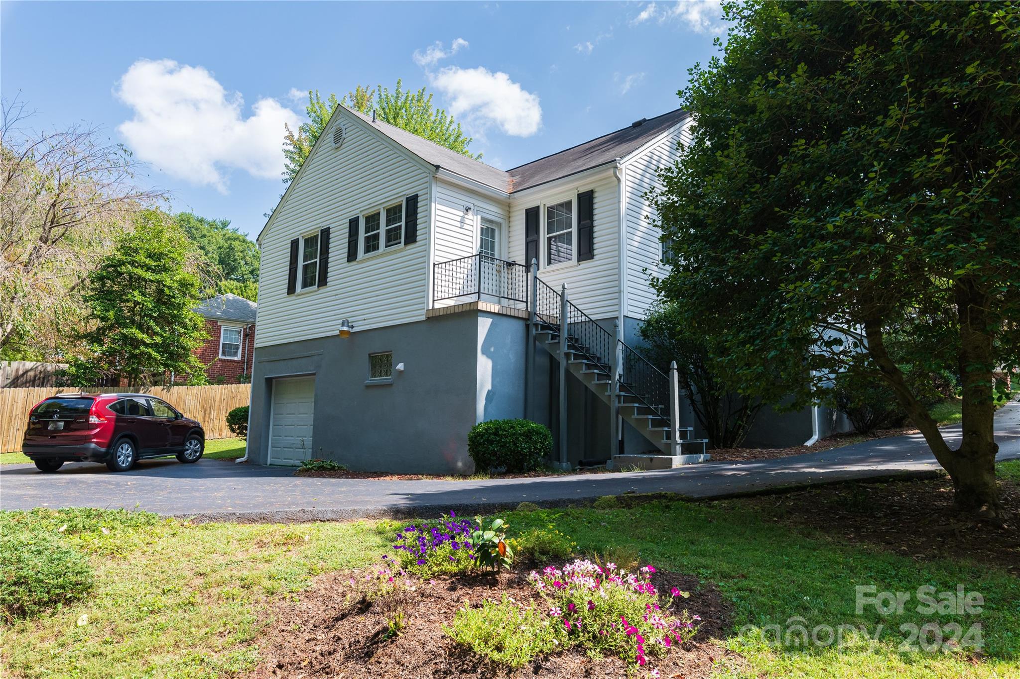 155 Arthur Road Asheville, NC 28806 - Photo 5 of 29 a front view of a house with a yard