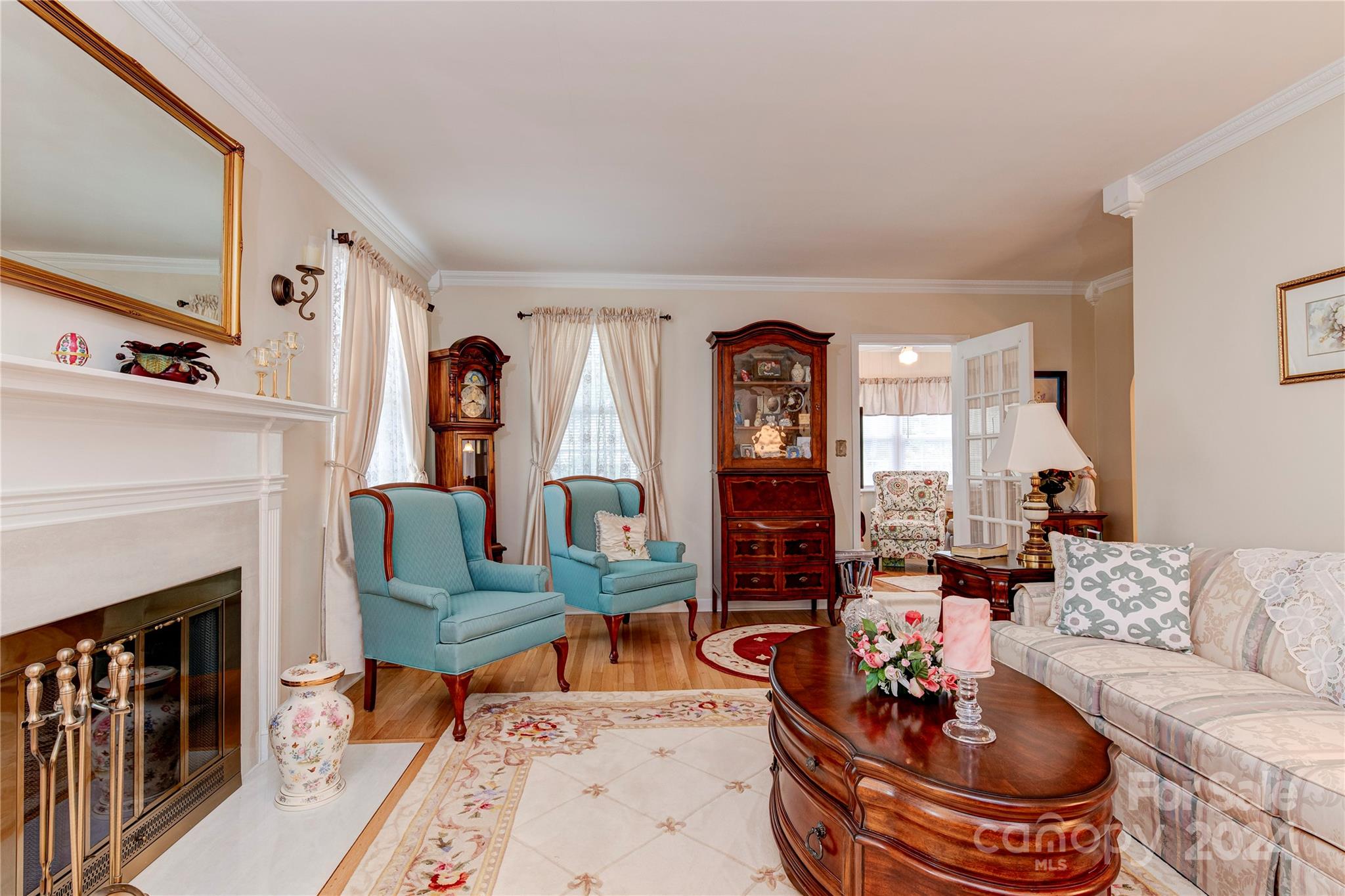 155 Arthur Road Asheville, NC 28806 - Photo 8 of 29 a living room with furniture a fireplace and a table