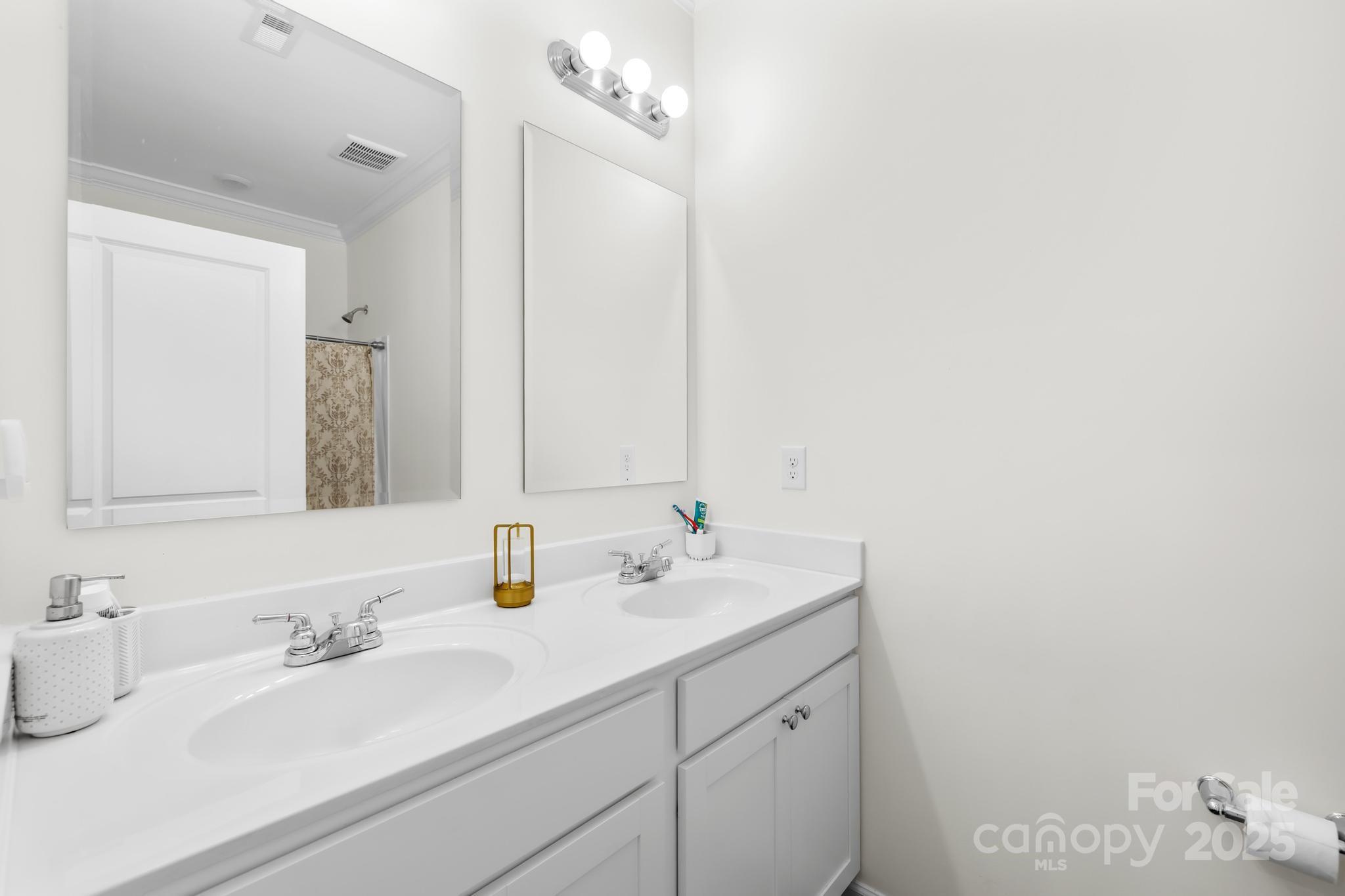 128 West Neel Ranch Road Mooresville, NC 28115 - Photo 13 of 27 a bathroom with a sink and a mirror