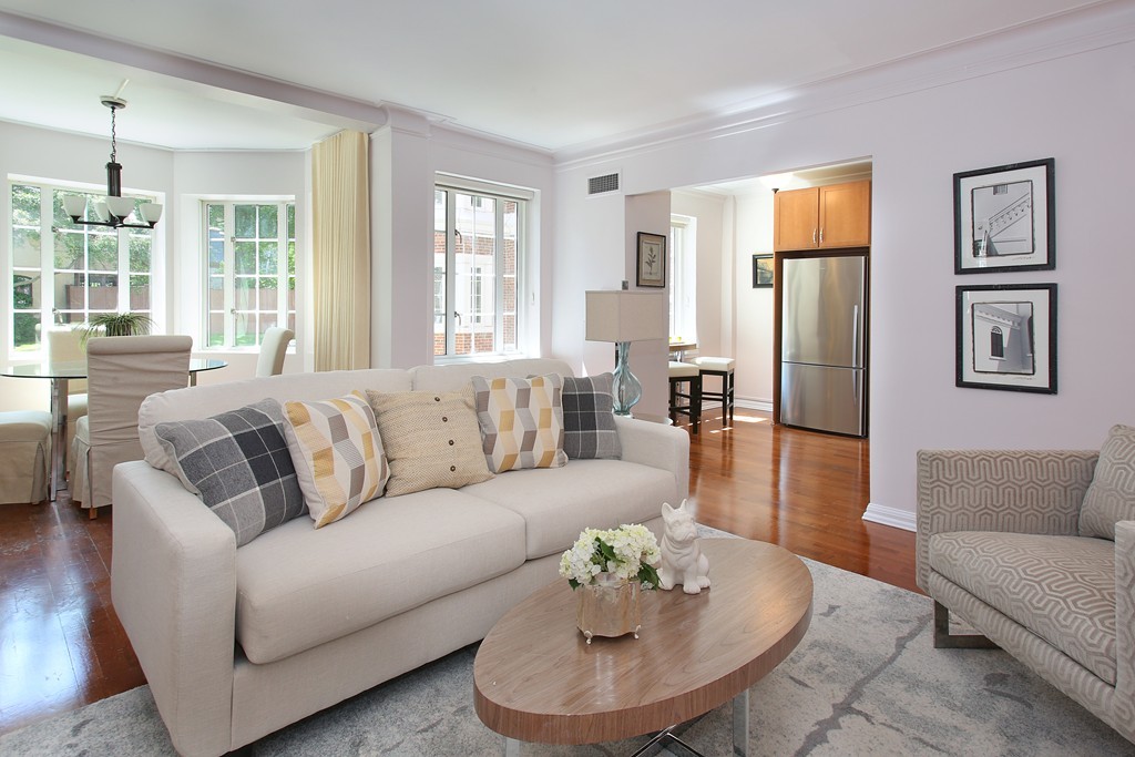 20 Chapel Street, Unit B411 Brookline, MA 02446 - Photo 1 of 18 a living room with furniture rug and window