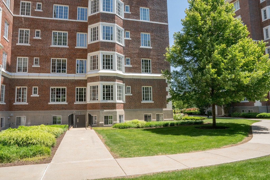 20 Chapel Street, Unit B411 Brookline, MA 02446 - Photo 18 of 18 a front view of a building with garden
