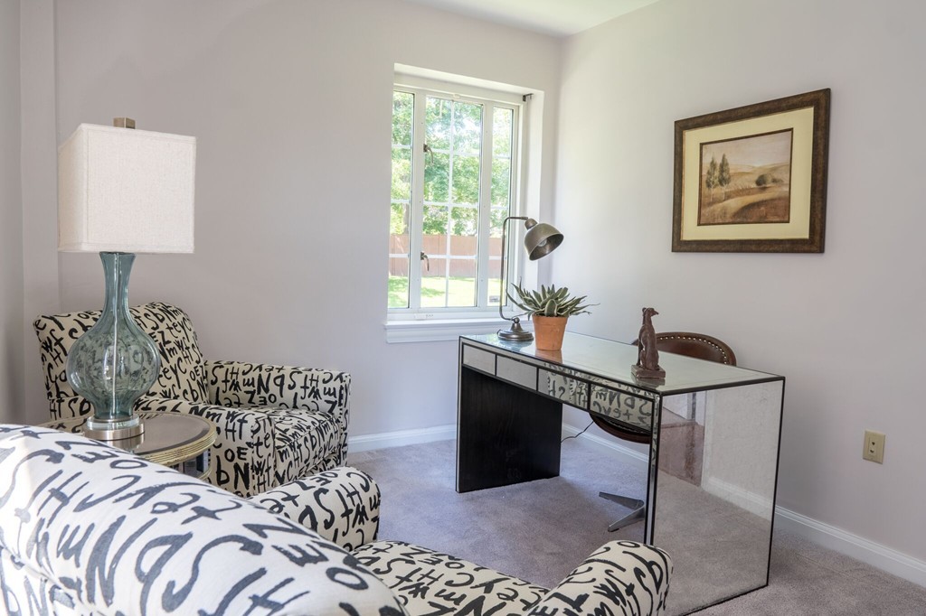 20 Chapel Street, Unit B411 Brookline, MA 02446 - Photo 7 of 18 a bedroom with bed and a window