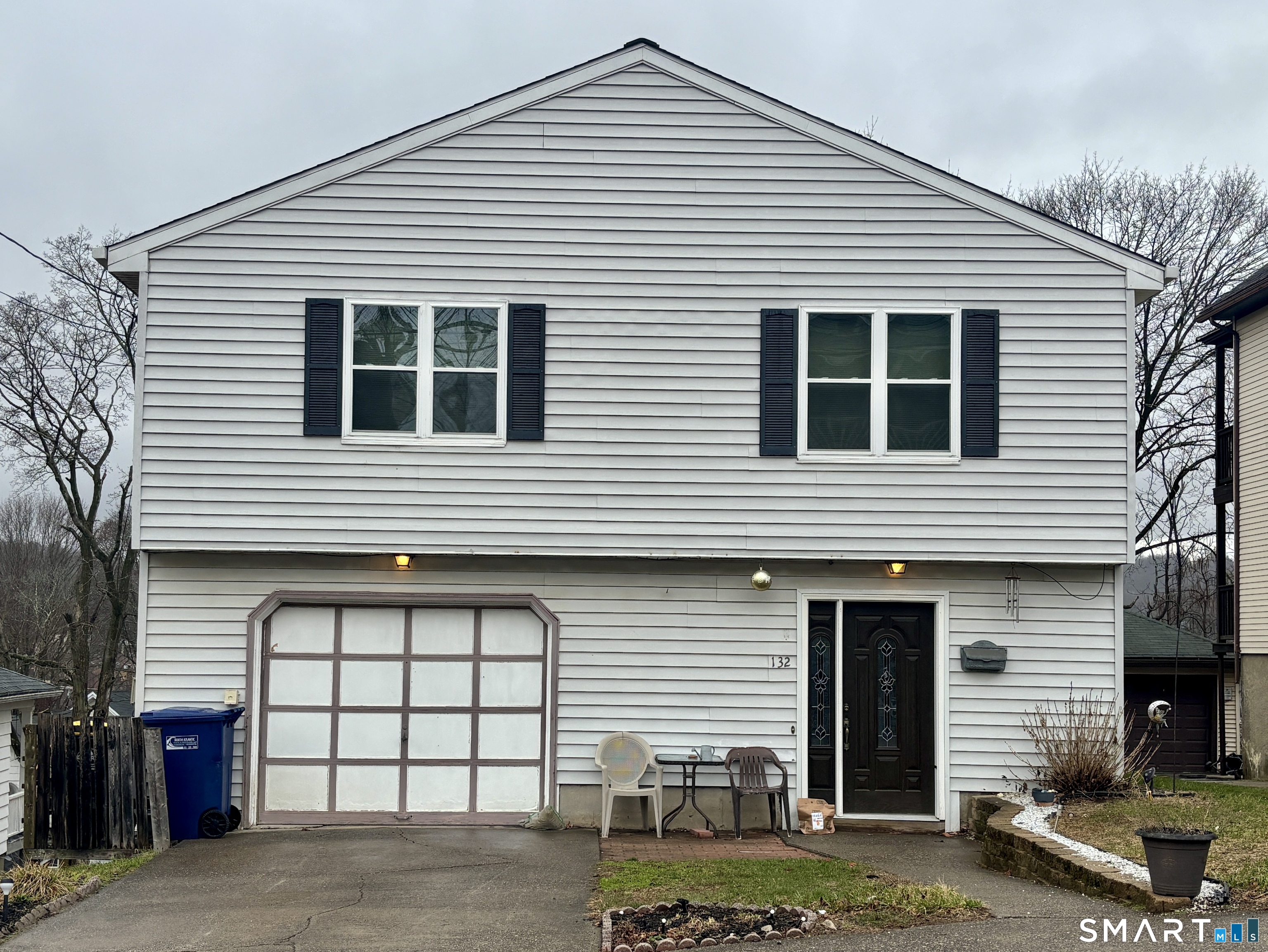 a front view of a house with parking space