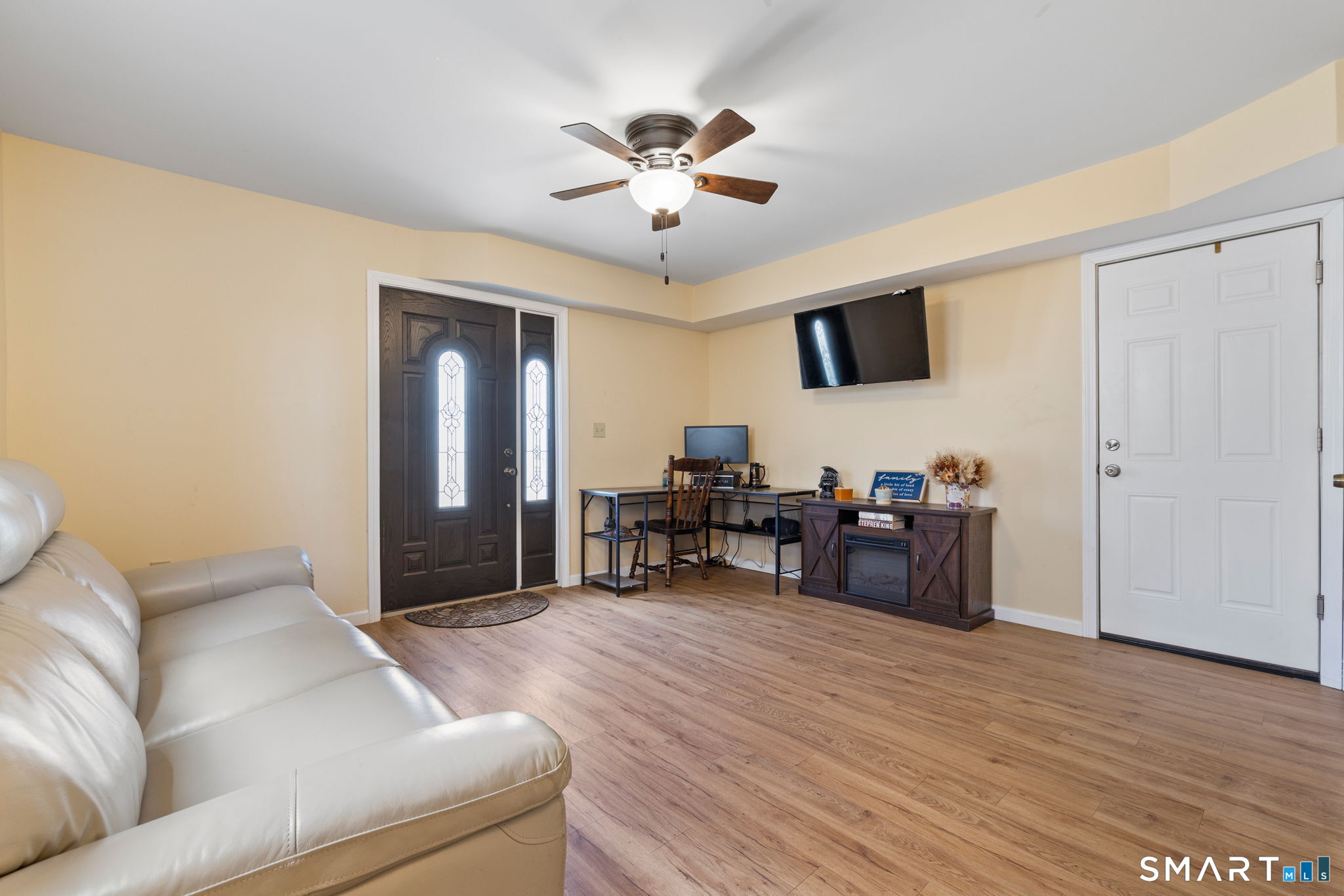132 Howard Avenue Ansonia, CT 06401 - Photo 14 of 41 a living room with furniture and a wooden floor