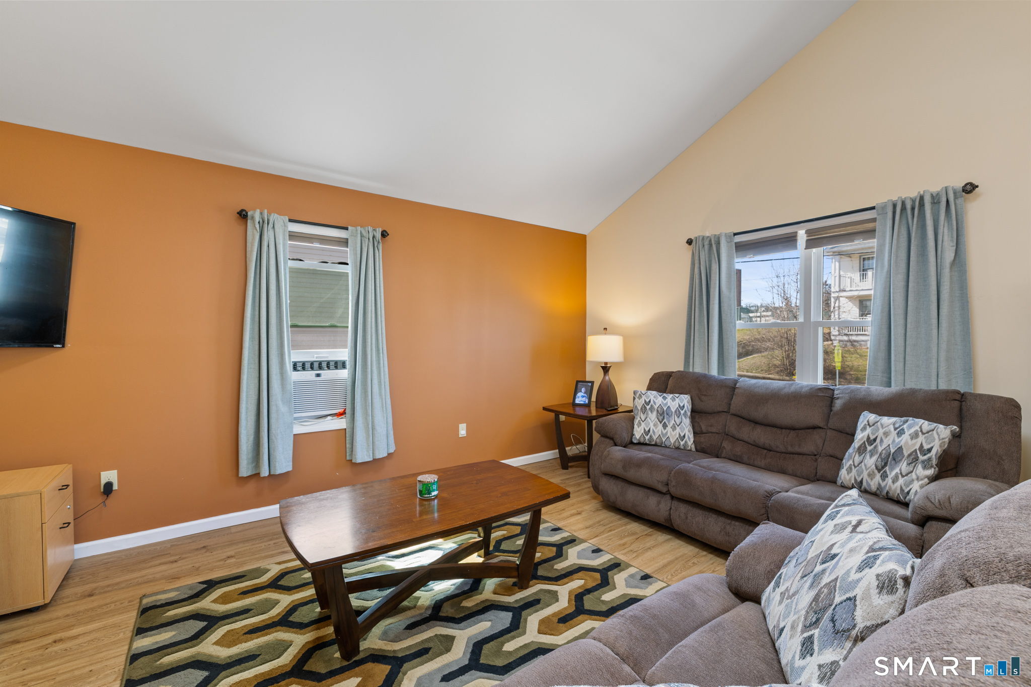 132 Howard Avenue Ansonia, CT 06401 - Photo 20 of 41 a living room with furniture and a flat screen tv
