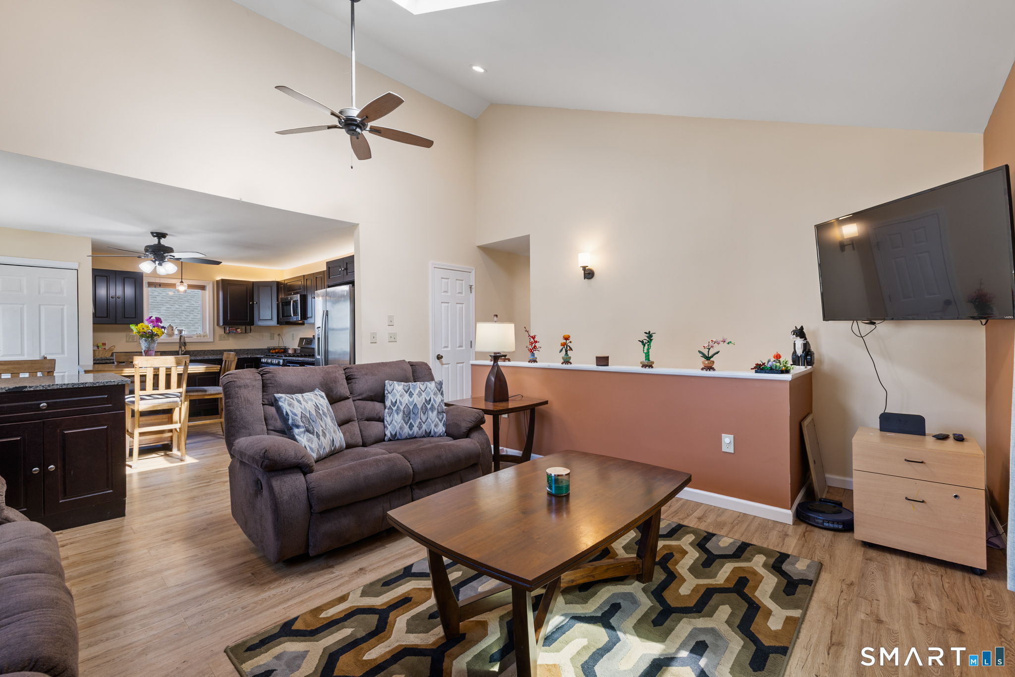 132 Howard Avenue Ansonia, CT 06401 - Photo 22 of 41 a living room with furniture and a flat screen tv