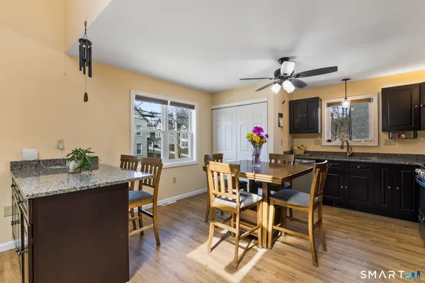 a view of a dining room with furniture and wooden floor