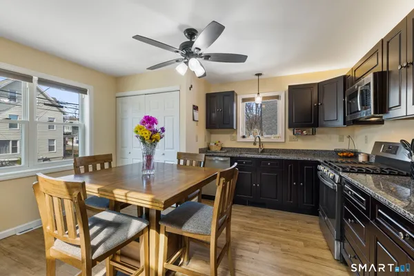 a view of a dining room with furniture and wooden floor