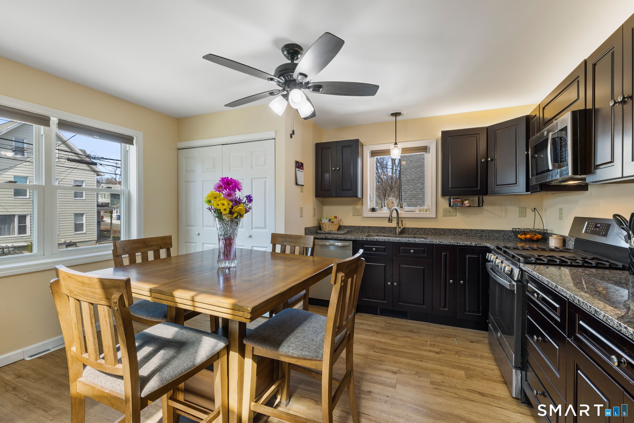 132 Howard Avenue Ansonia, CT 06401 - Photo 26 of 41 a view of a dining room with furniture and wooden floor
