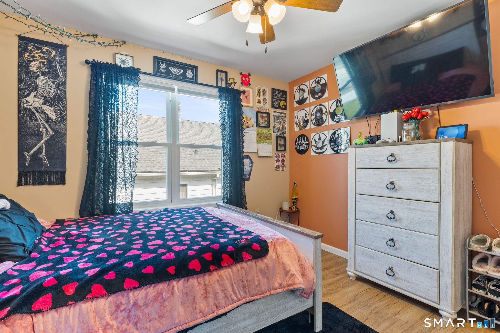 132 Howard Avenue Ansonia, CT 06401 - Photo 39 of 41 a bedroom with a large bed and a chandelier