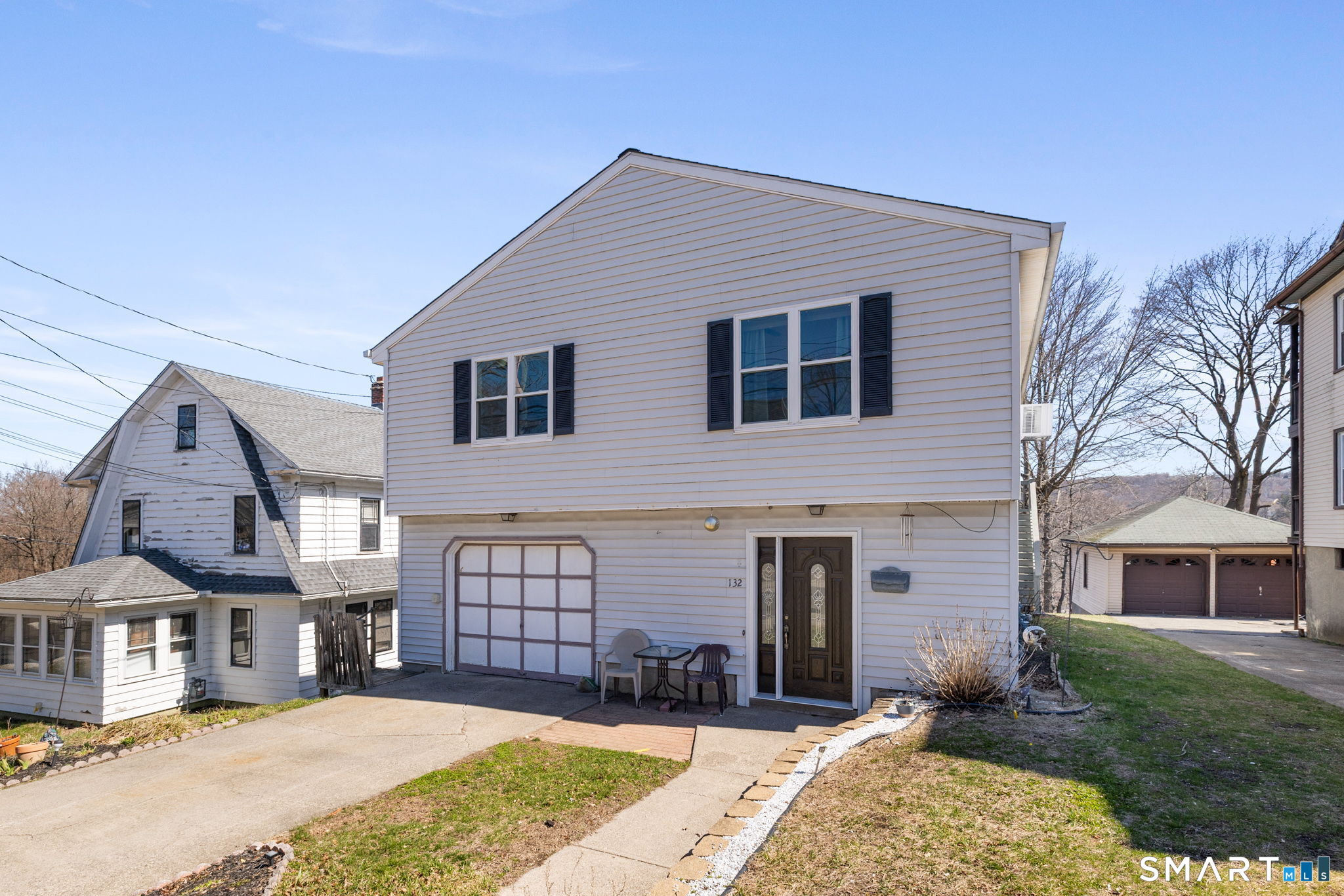 132 Howard Avenue Ansonia, CT 06401 - Photo 4 of 41 a front view of a house with a yard