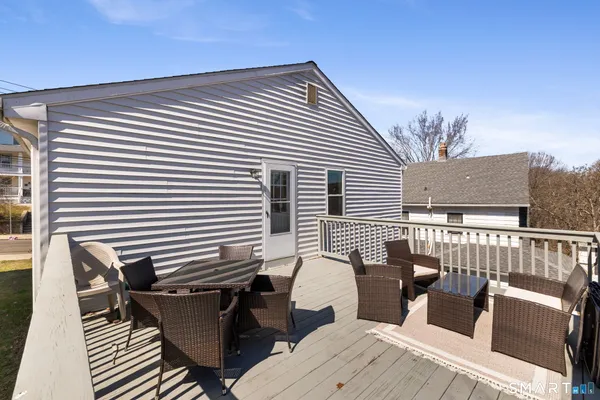 a view of a patio with couple of chairs