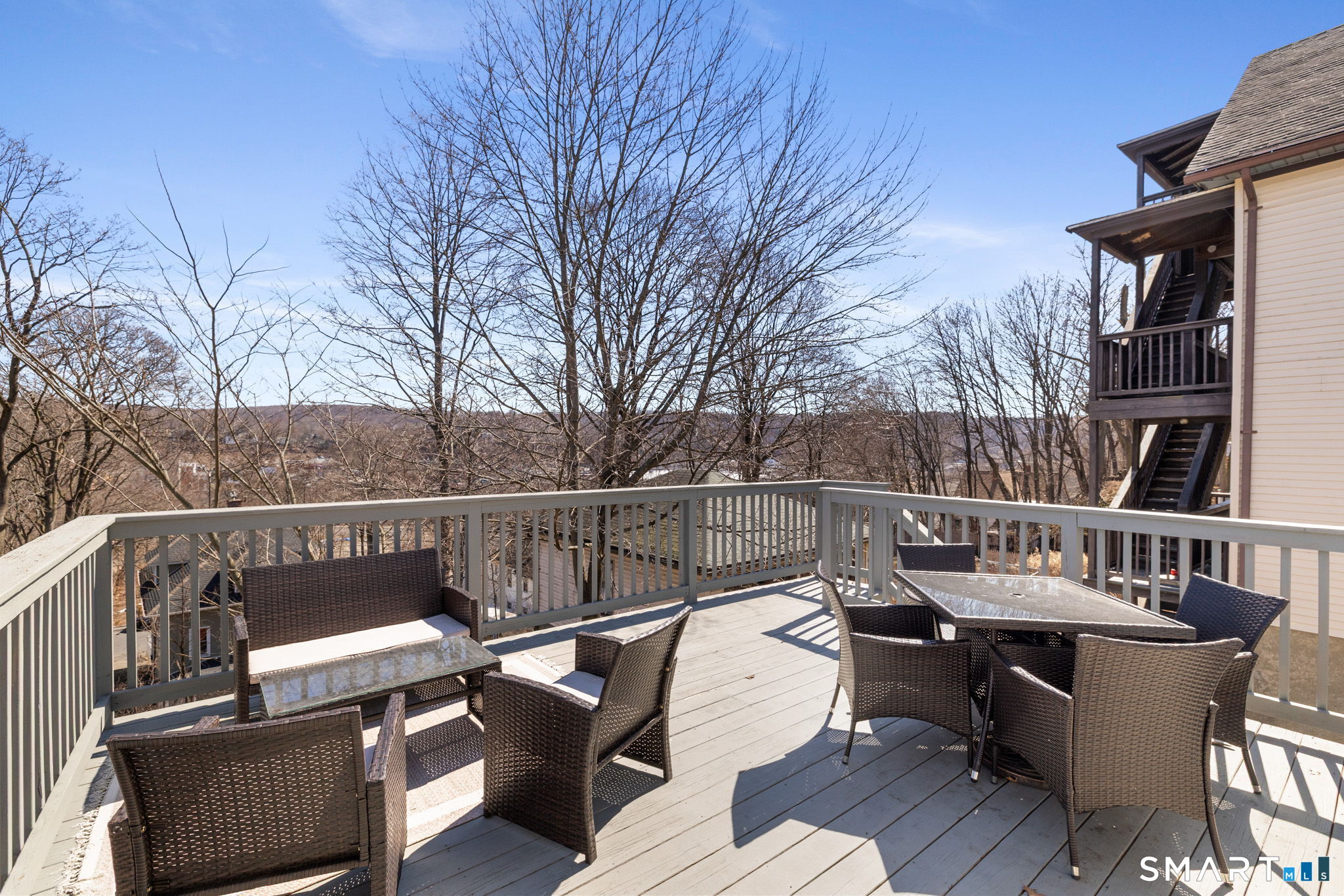 132 Howard Avenue Ansonia, CT 06401 - Photo 6 of 41 a view of a roof deck with couches and wooden floor