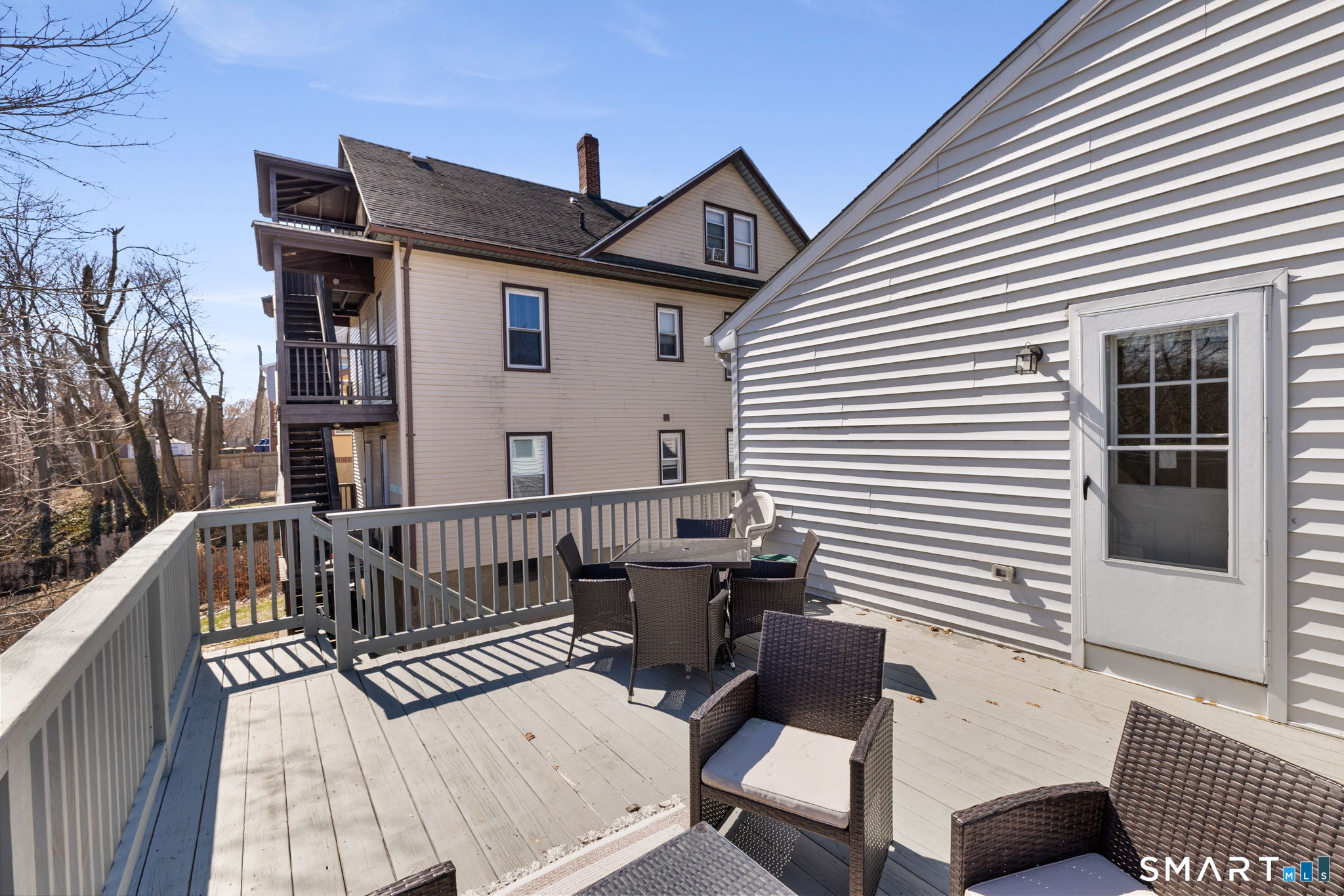 132 Howard Avenue Ansonia, CT 06401 - Photo 7 of 41 a view of a roof deck with chair and wooden floor