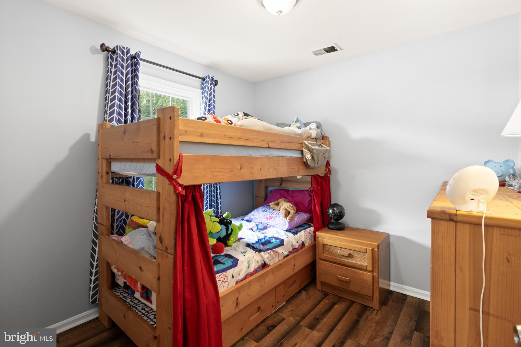 8573 Tyrolean Way Springfield, VA 22153 - Photo 20 of 32 a bed room with furniture and a window