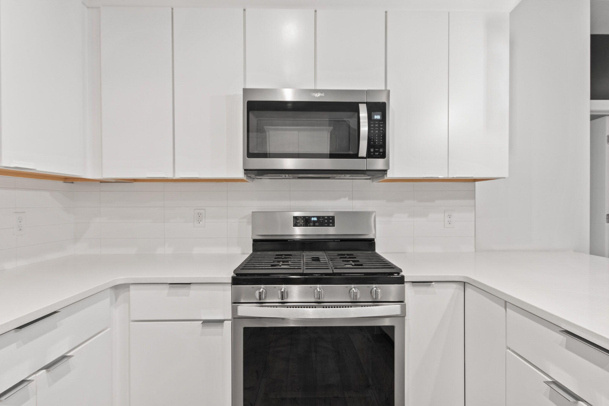 255 Nomo Place Crown Point, IN 46307 - Photo 17 of 83 a kitchen with microwave cabinets and stove top oven
