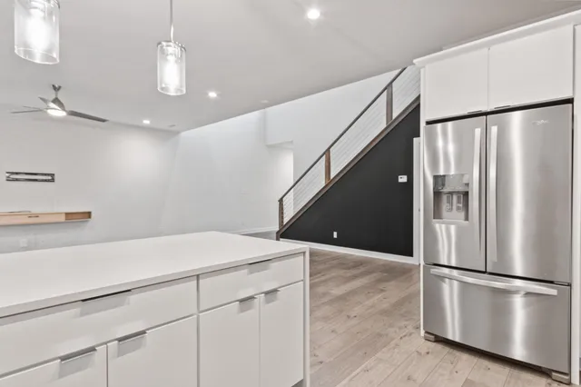 an empty room with windows and closet