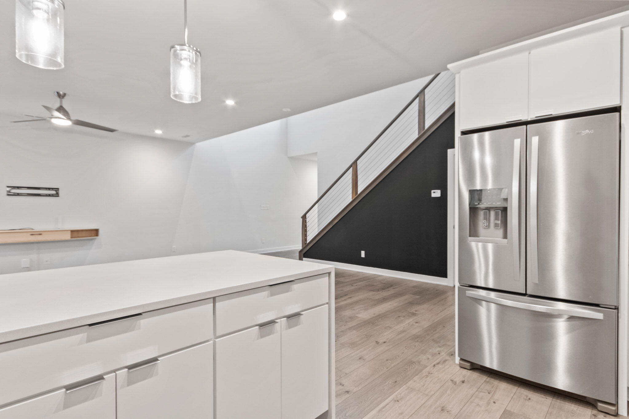 255 Nomo Place Crown Point, IN 46307 - Photo 18 of 83 a kitchen with kitchen island a counter top space wooden floor and appliances