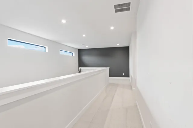 a bathroom with double vanity sinks and a mirror
