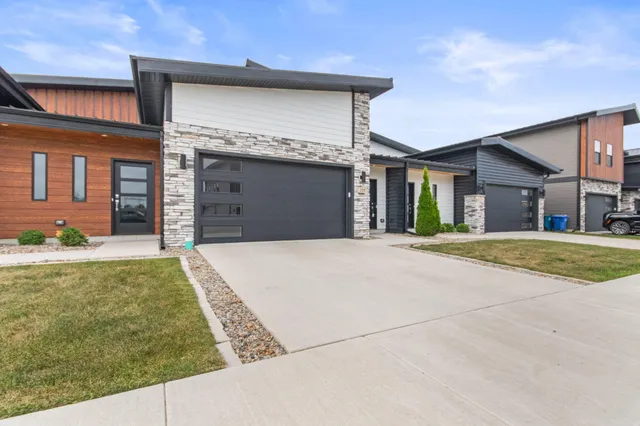 an empty room with wooden floor and a window