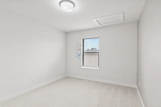 an aerial view of residential houses with outdoor space and swimming pool