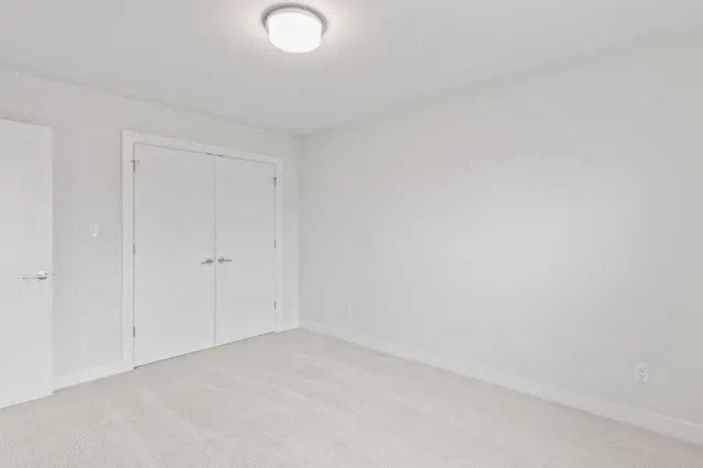 a view of a house with a yard and garage