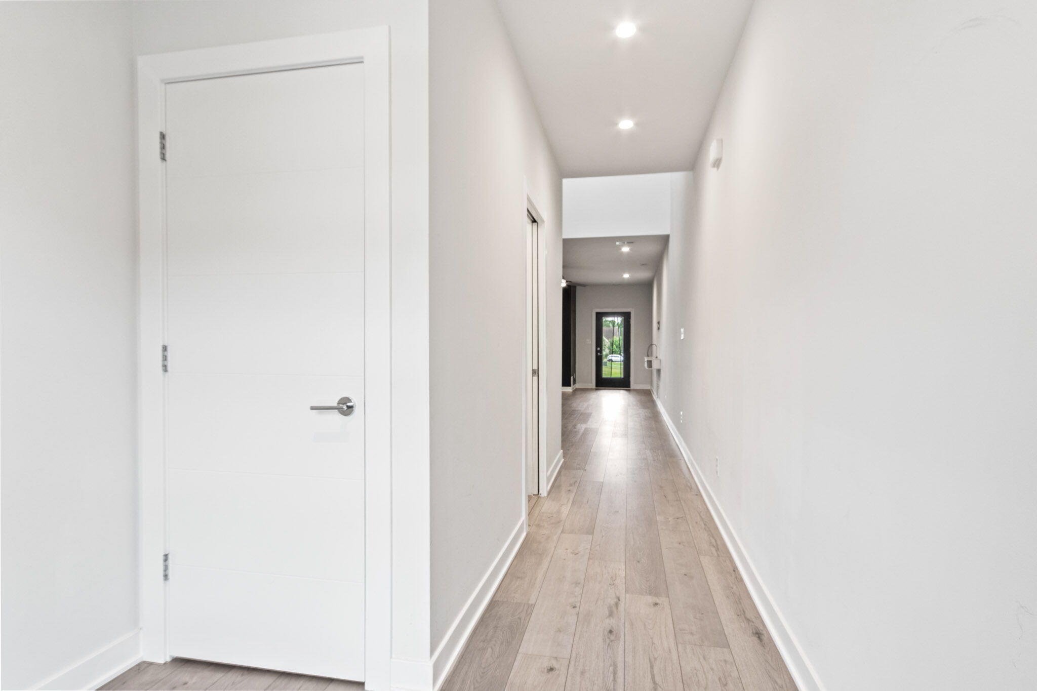 255 Nomo Place Crown Point, IN 46307 - Photo 8 of 83 a view of a hallway with wooden floor