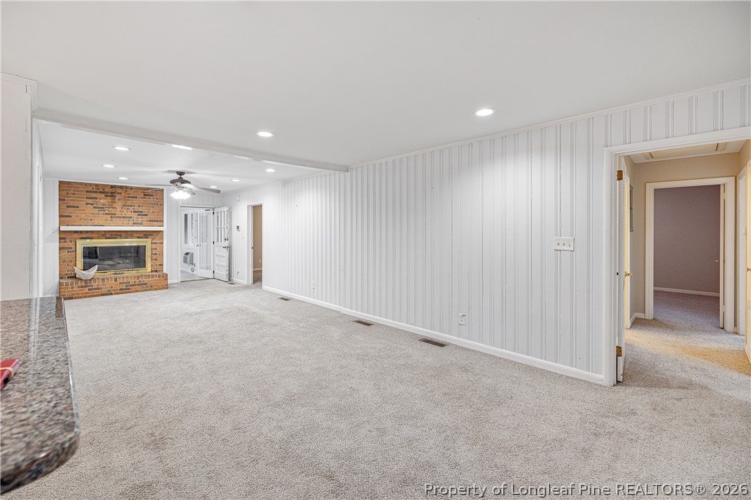 2527 Huntington Road Fayetteville, NC 28303 - Photo 17 of 39 a view of a livingroom with a fireplace