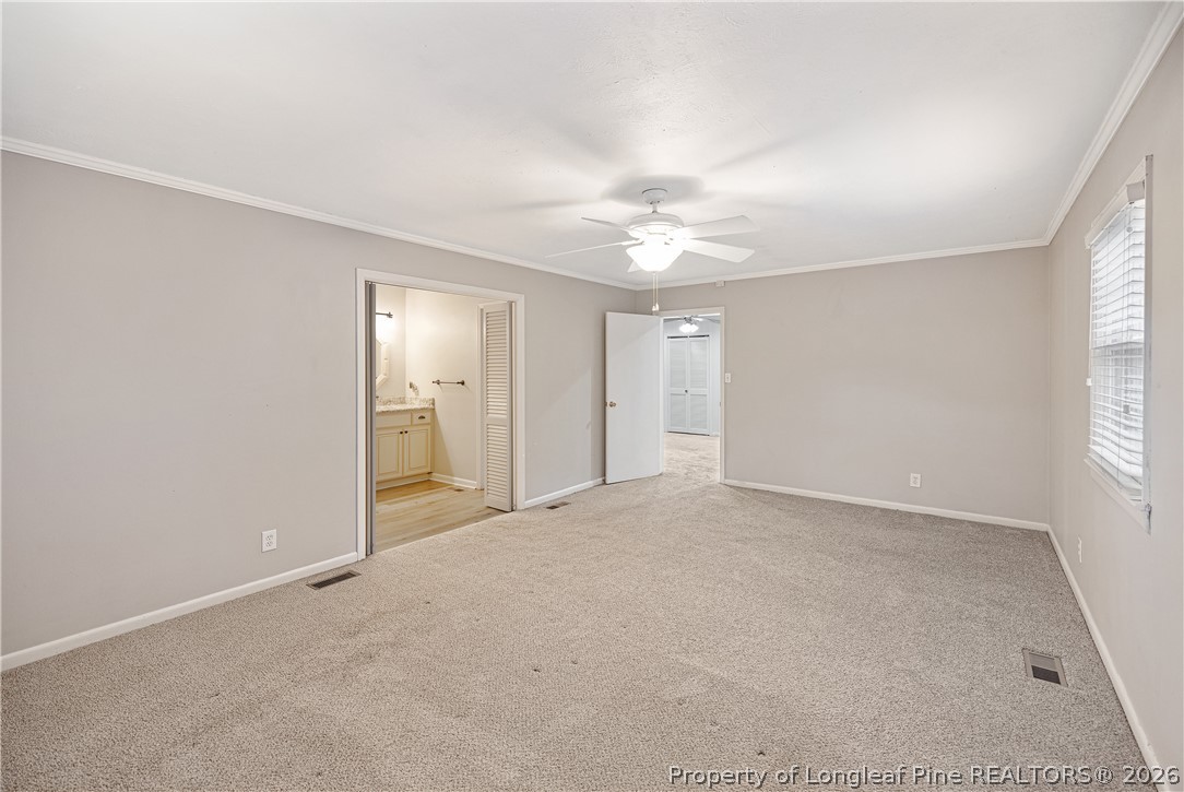 2527 Huntington Road Fayetteville, NC 28303 - Photo 22 of 39 an empty room with windows and closet
