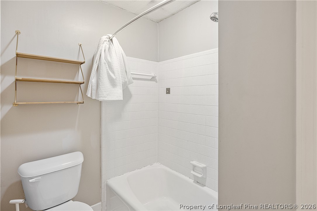 2527 Huntington Road Fayetteville, NC 28303 - Photo 24 of 39 a bathroom with a toilet and a shower
