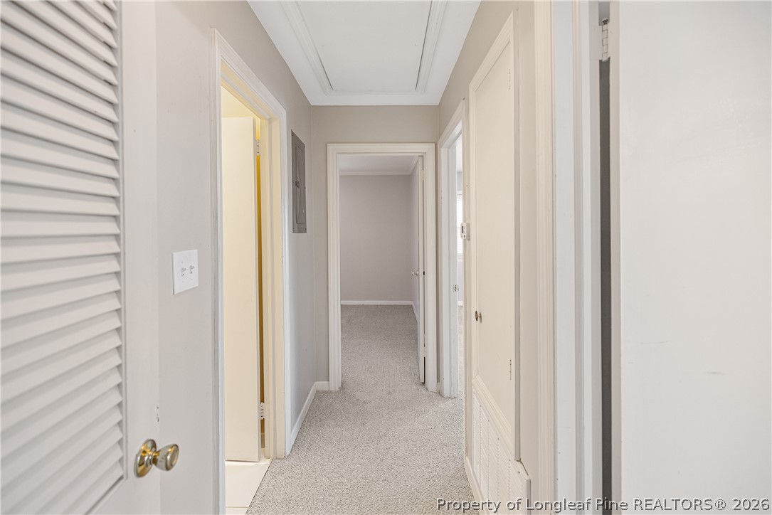 2527 Huntington Road Fayetteville, NC 28303 - Photo 25 of 39 a view of a bathroom from a corridor