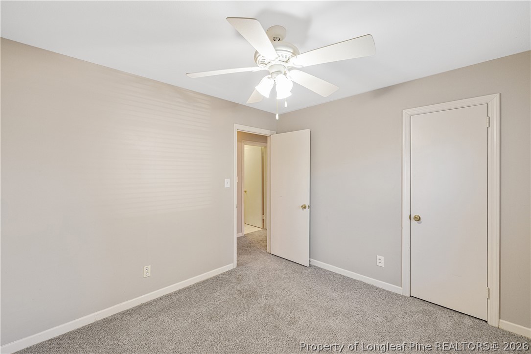 2527 Huntington Road Fayetteville, NC 28303 - Photo 27 of 39 an empty room with a fan and a fan