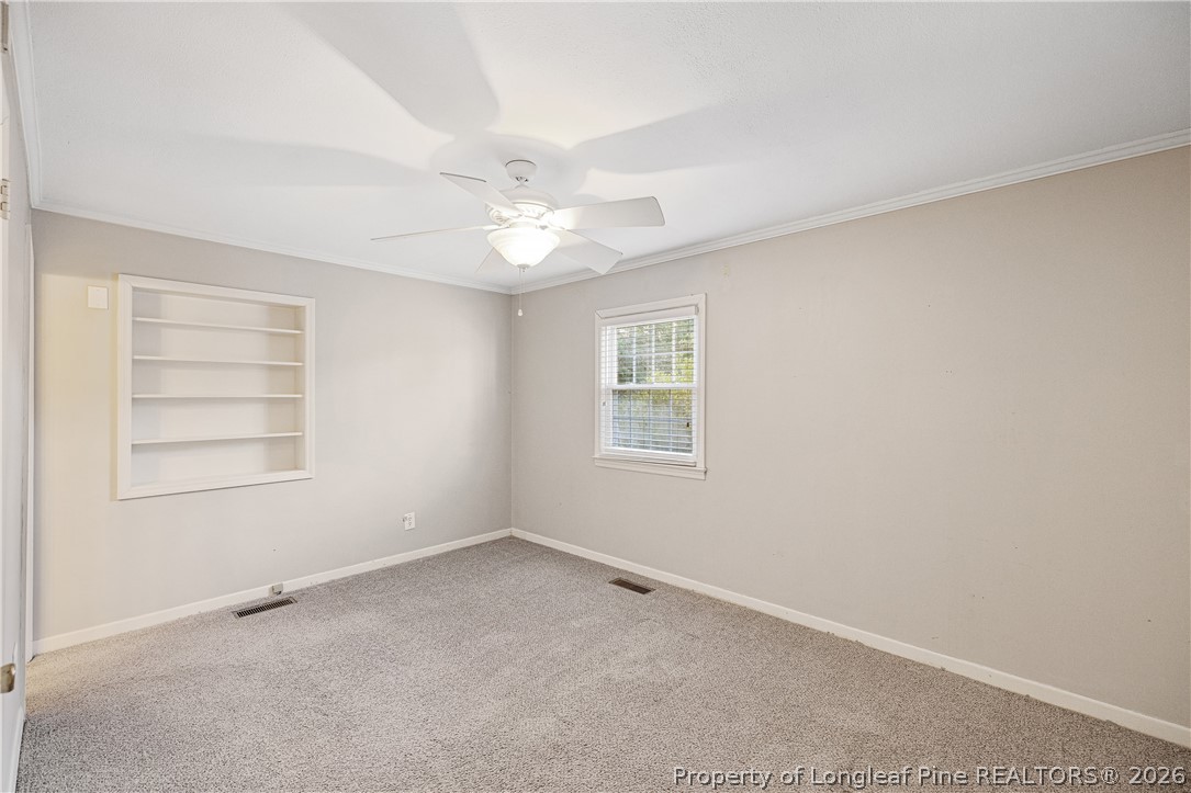 2527 Huntington Road Fayetteville, NC 28303 - Photo 29 of 39 an empty room with a window