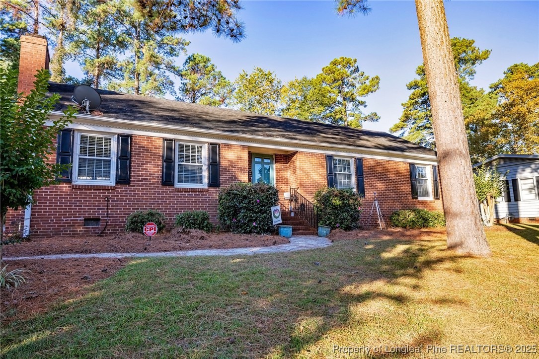 2527 Huntington Road Fayetteville, NC 28303 - Photo 3 of 39 front view of a house with a yard