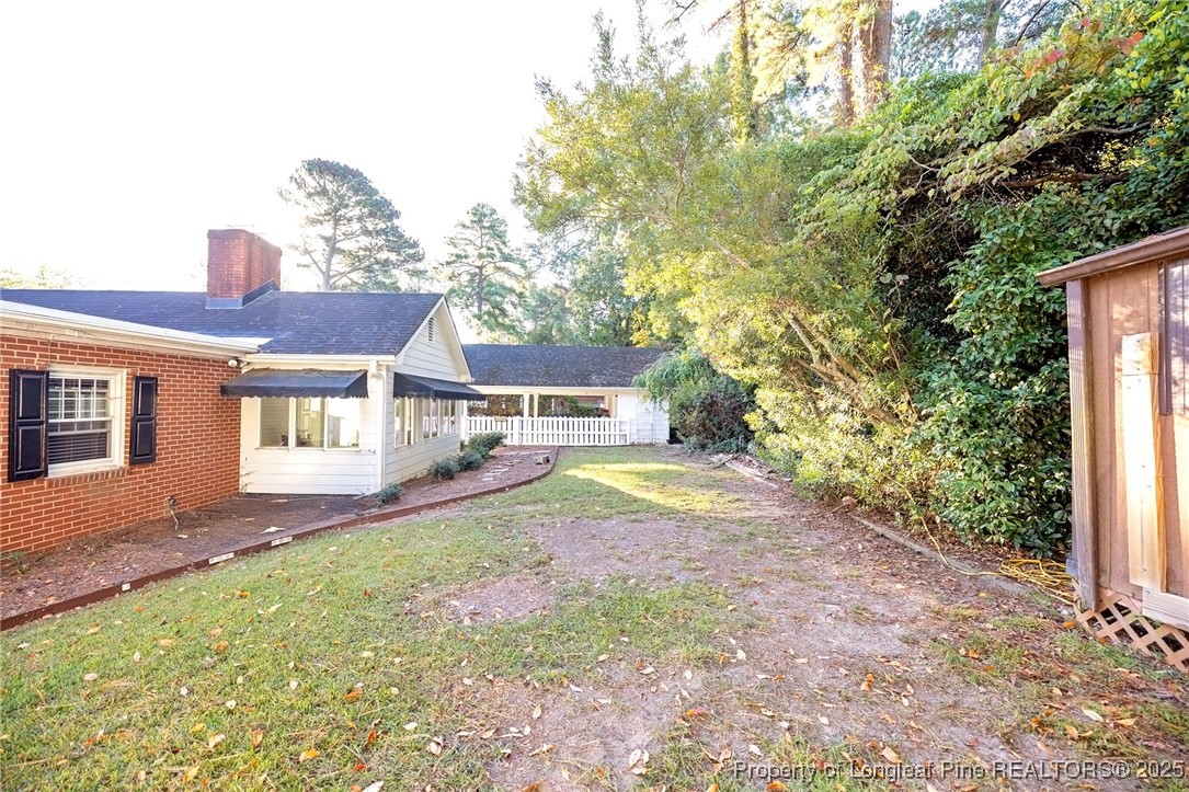 2527 Huntington Road Fayetteville, NC 28303 - Photo 35 of 39 a view of a house with backyard and sitting area