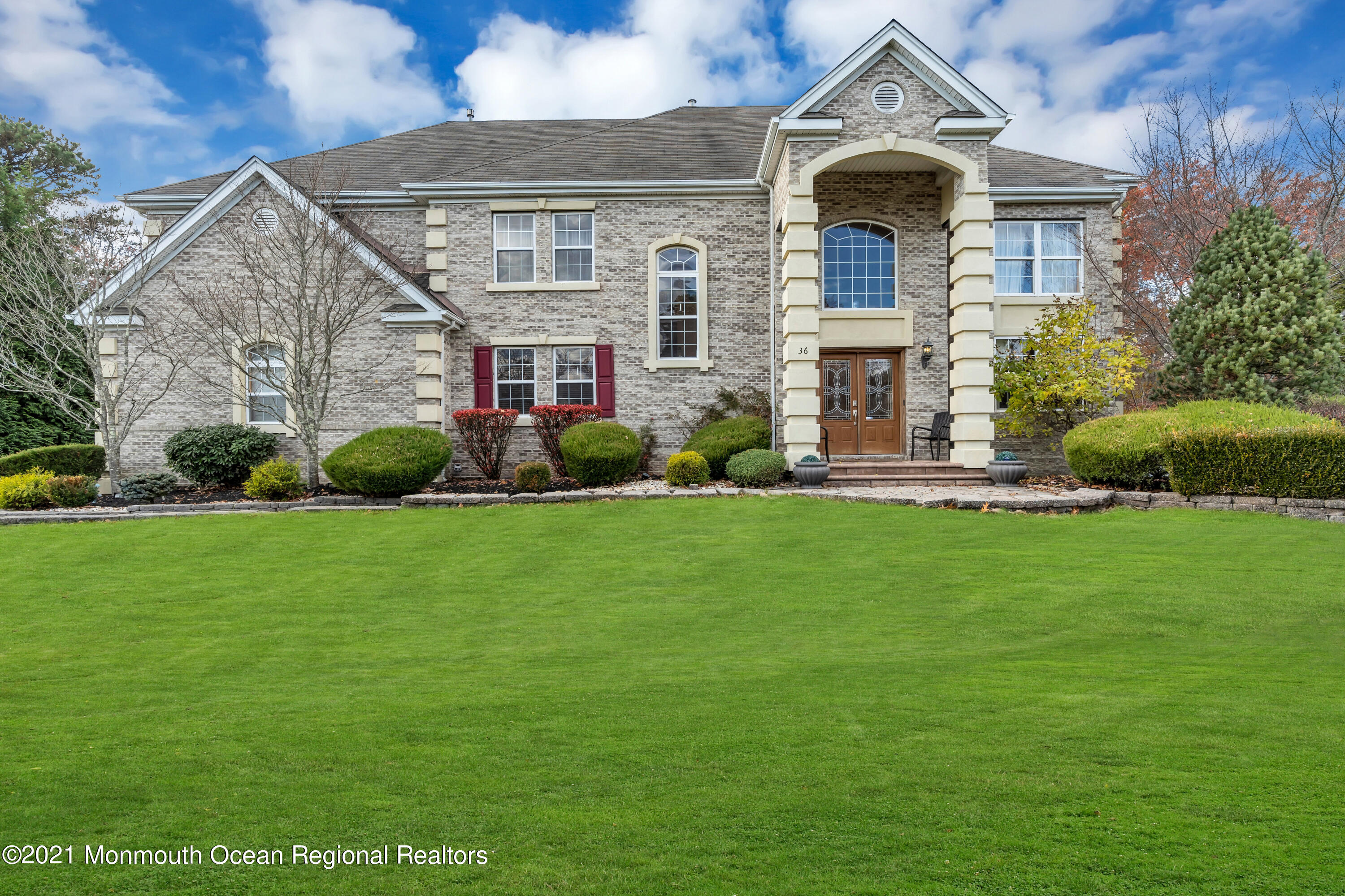 36 Woods Edge Drive Jackson, NJ 08527 - Photo 2 of 85 a front view of a house with a garden