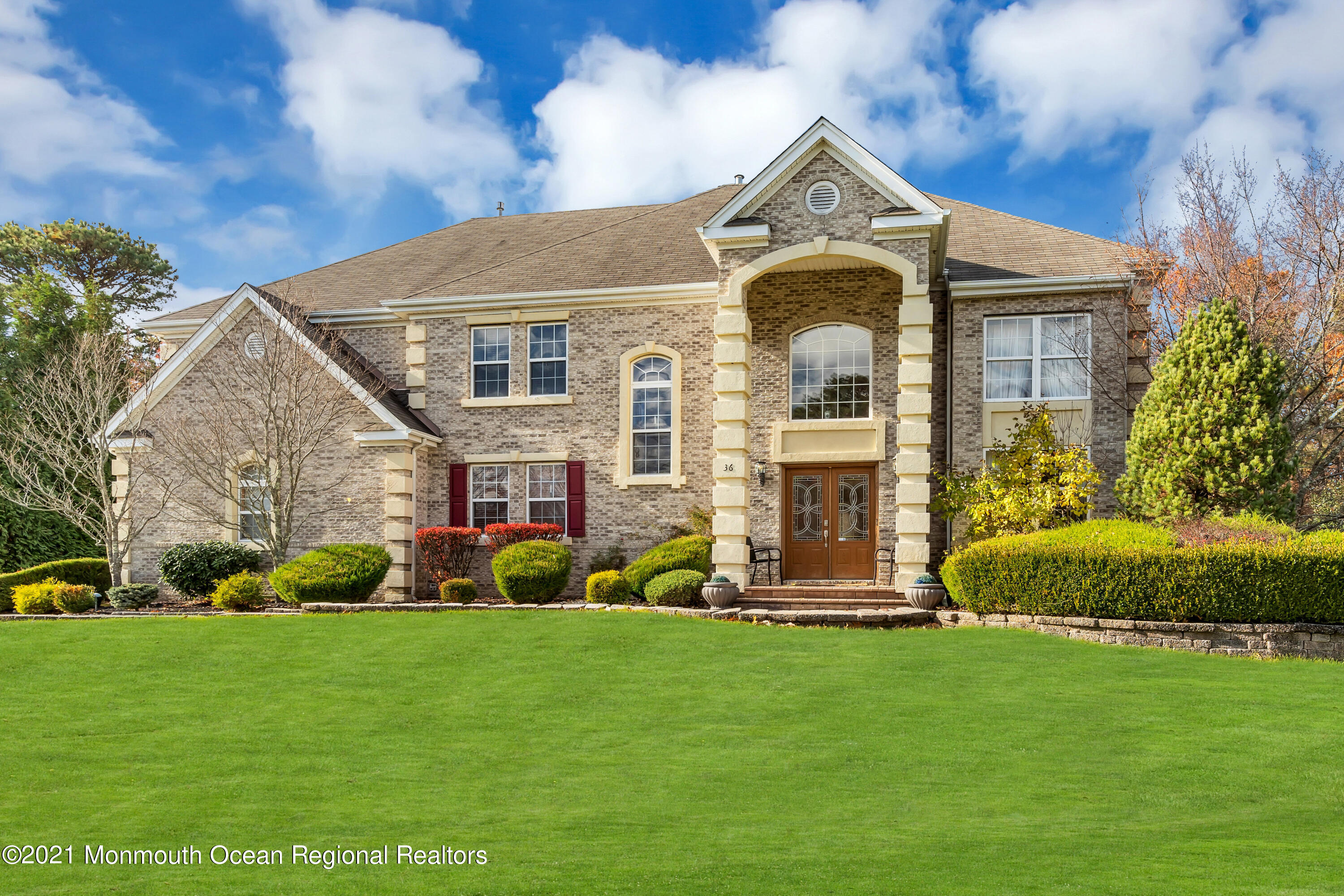 36 Woods Edge Drive Jackson, NJ 08527 - Photo 3 of 85 a front view of a house with garden