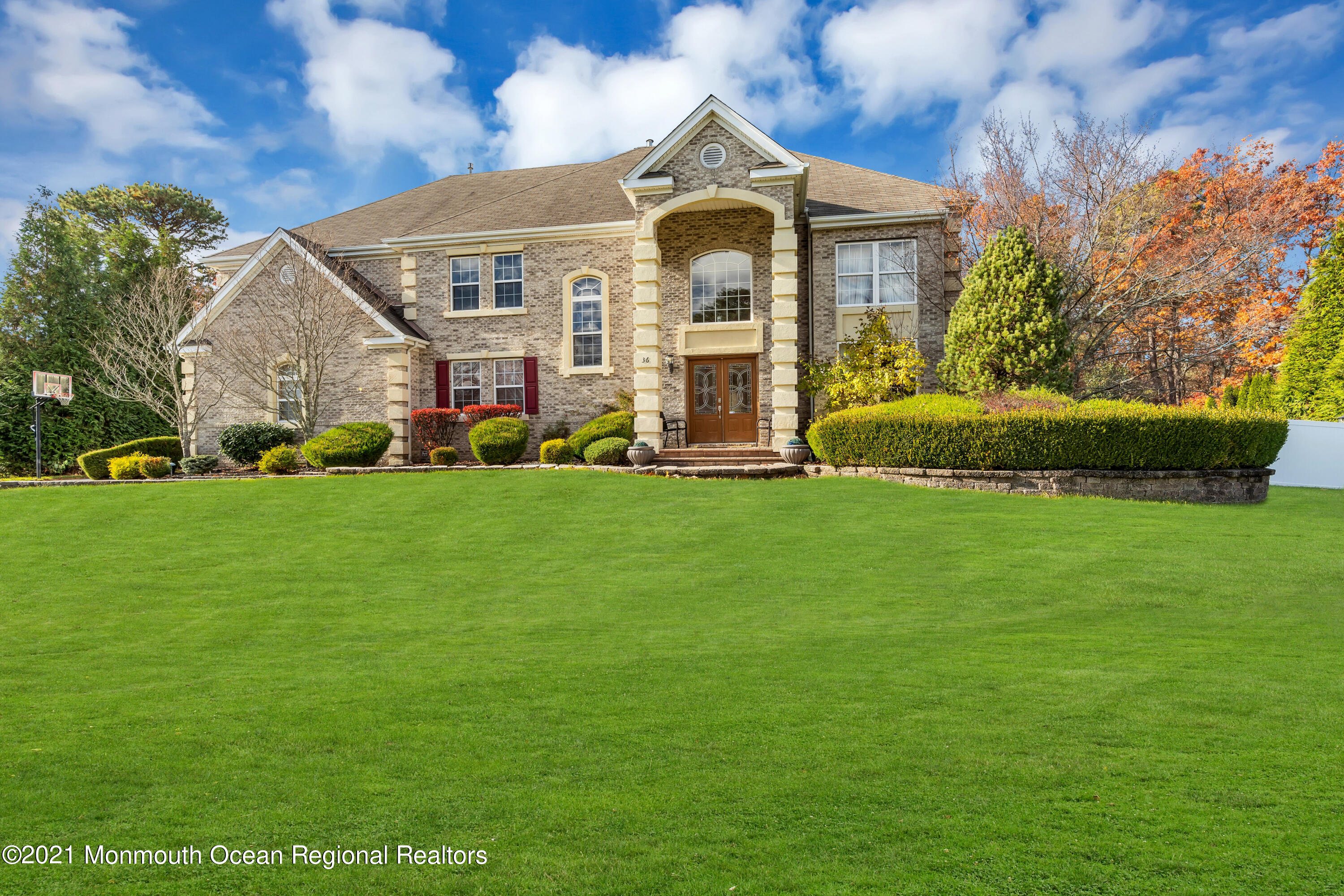 36 Woods Edge Drive Jackson, NJ 08527 - Photo 6 of 85 a front view of a house with a garden