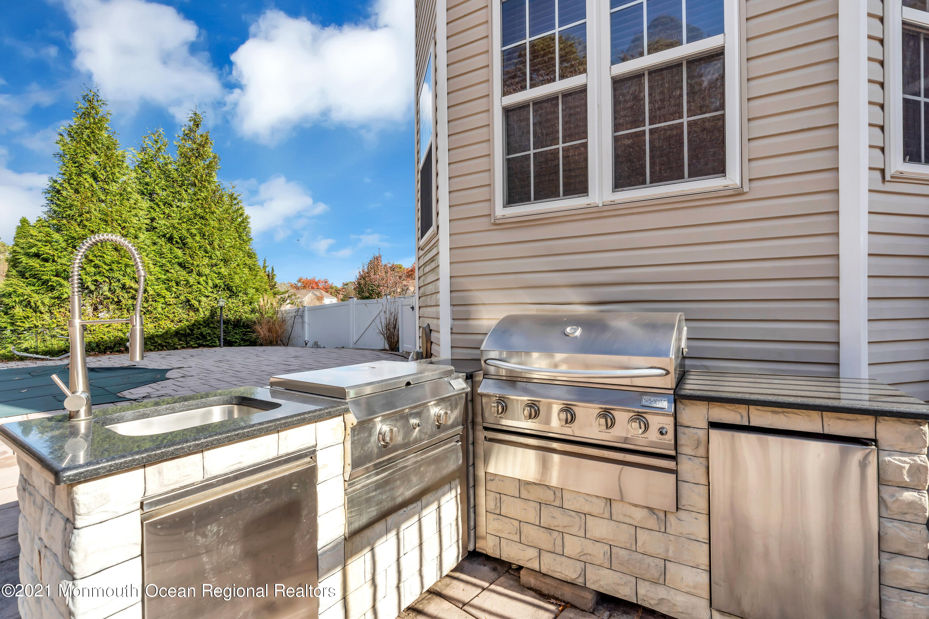 36 Woods Edge Drive Jackson, NJ 08527 - Photo 84 of 85 a open kitchen with stainless steel appliances granite countertop a stove and a white house