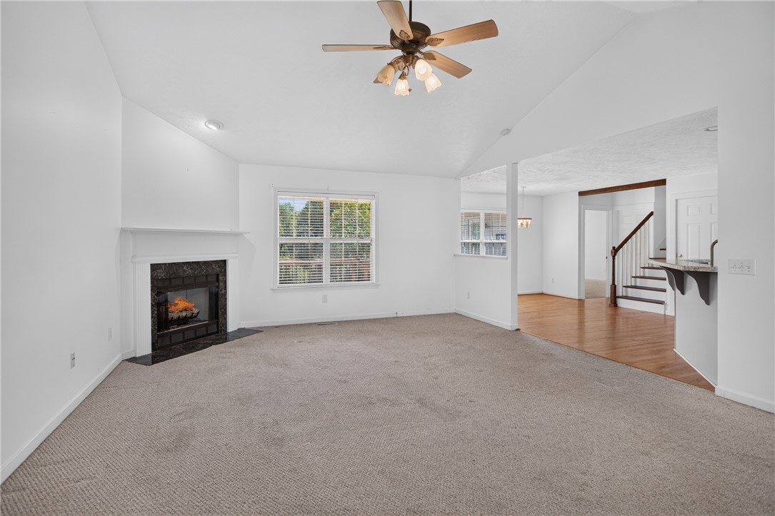 612 Providence Point Drive Seneca, SC 29678 - Photo 3 of 43 Warm and inviting, this living area features a cozy fireplace and abundant natural light.