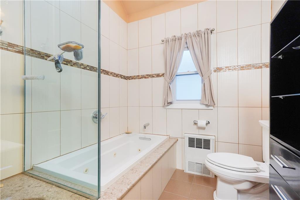 151 81st Street Brooklyn, NY 11209 - Photo 18 of 37 a bathroom with a sink toilet and shower