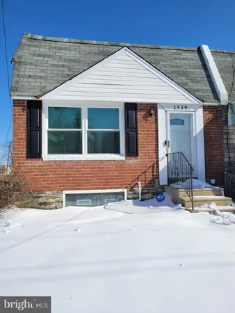 a front view of a house with yard